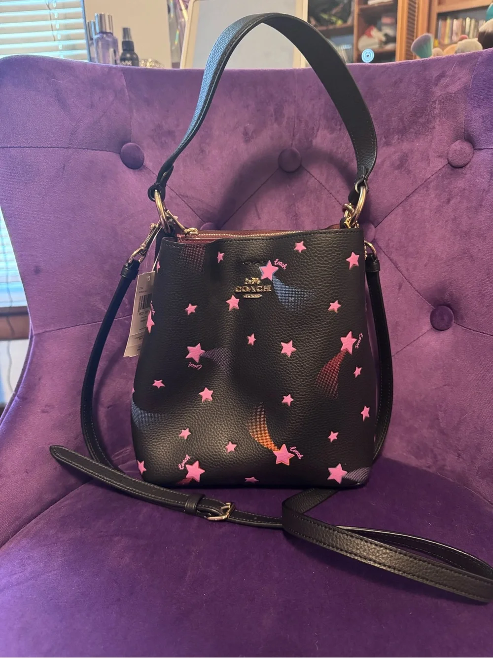 Coach Black Leather Bucket Bag with Pink Star Print